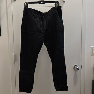 Paige Mayslie black waxed denim joggers with zippers